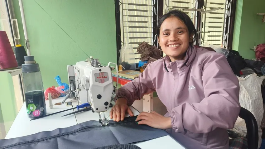 A young Nepalese woman attending basic tailoring training at Lily's Leaves
