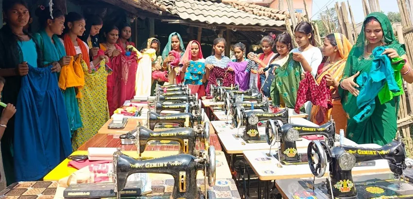 Basic tailoring graduates with gifted sewing machines and tables