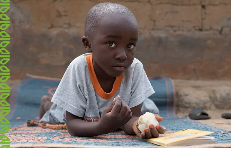 Four year old Prince is growing up in a refugee camp in Zambia where his mum has established a backyard garden