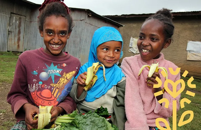 Ethiopian children enjoying a diet that includes fruit and vegetables