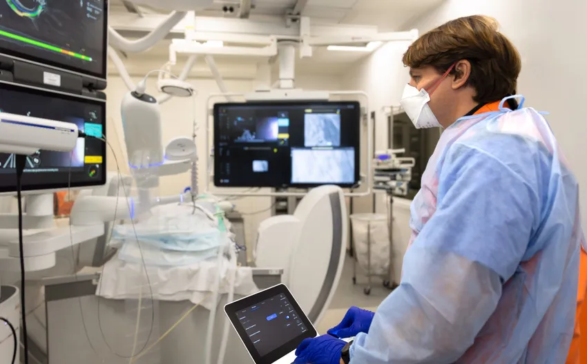 A surgeon operating the Ion robot