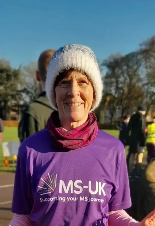 Linda, helpline client, wearing her running gear including her MS-UK t-shirt as she raises funds for MS-UK