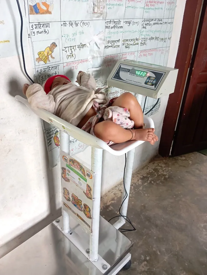 Baby on weighing machine