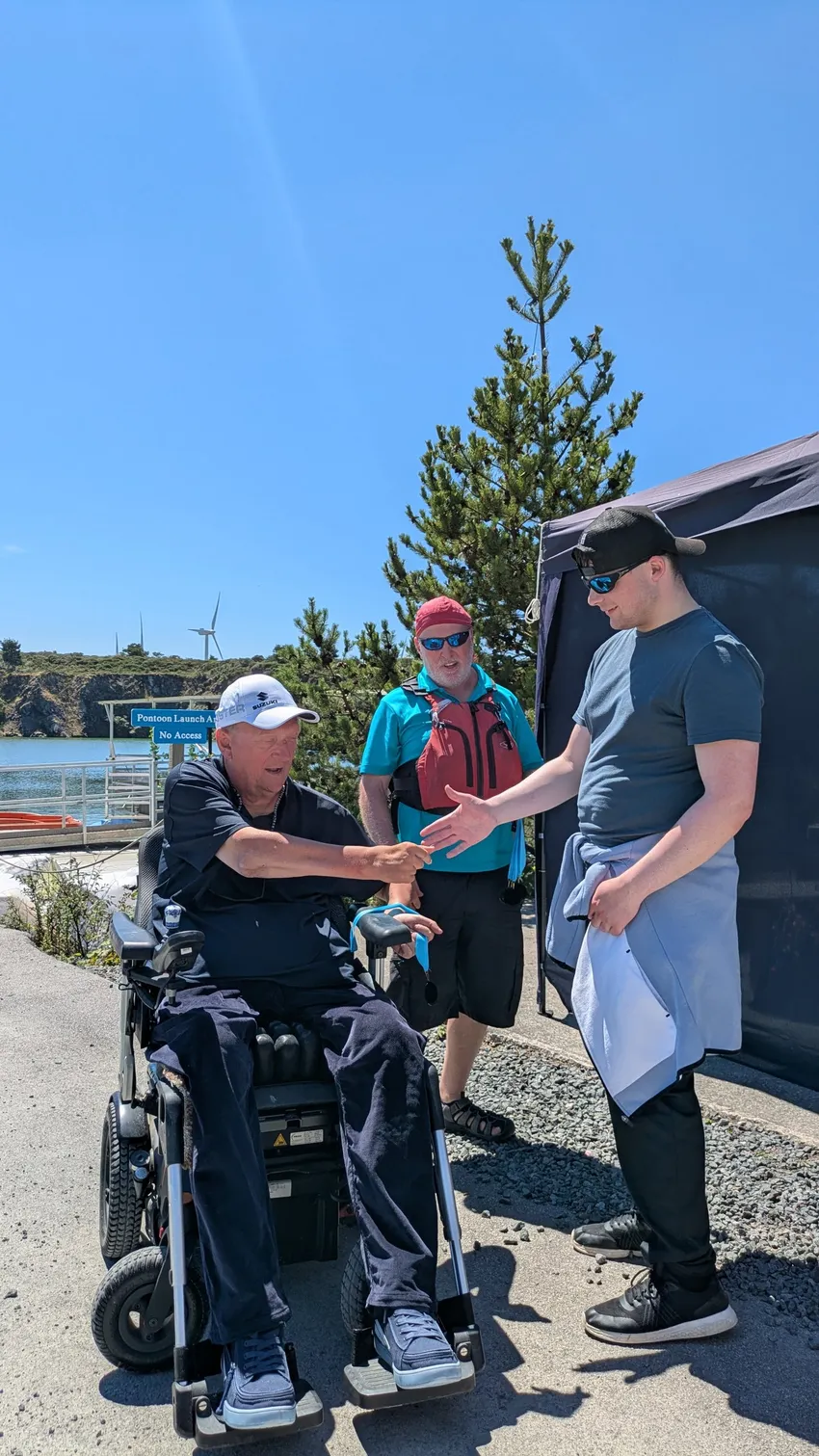 Geoff Holt handing out a medal at our Inclusive Games 2026