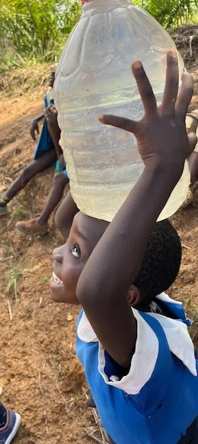 Cameroon girl with water