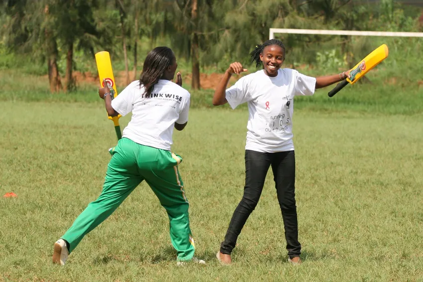 young women playing cricket