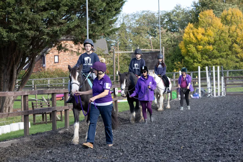 Learning to ride with support from our team of staff and volunteers