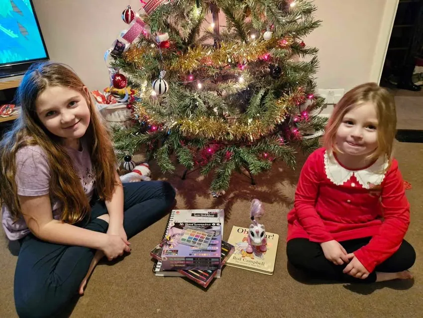 Children receiving gifts through the Christmas Appeal