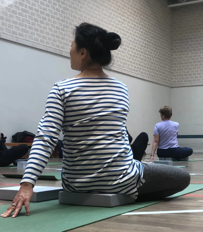 Woman doing yoga as part of Healthy Balance programme