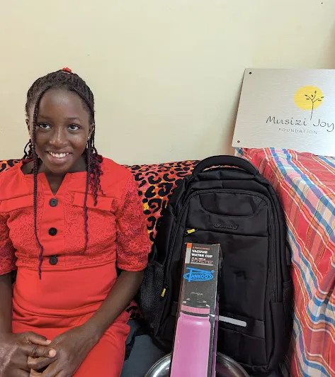 Patricia receiving her sponsorship gifts before starting term 1