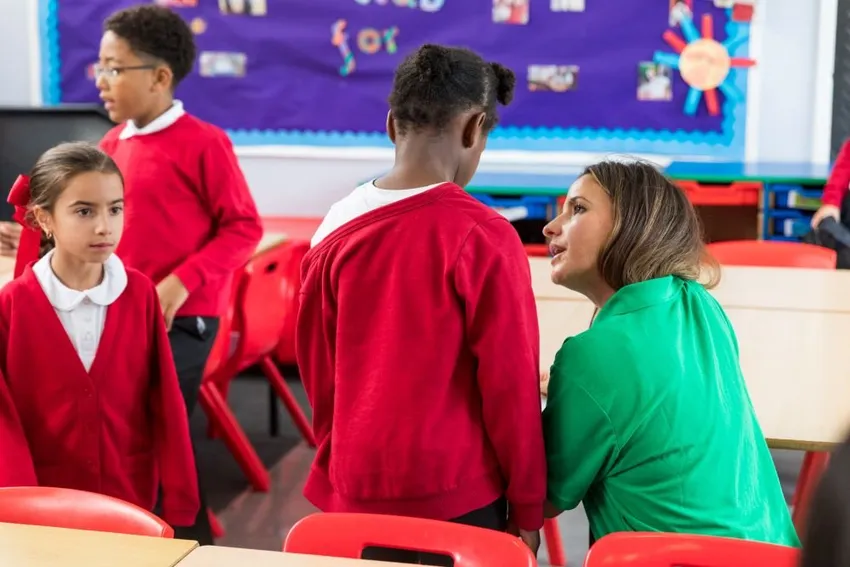 A Welcare Family Support Worker delivering a group for children in a school.