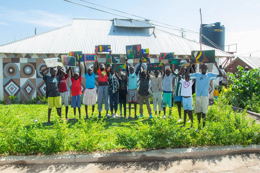 Art Class students with their paintings, outside classroom 1 at Gatwitch Hub