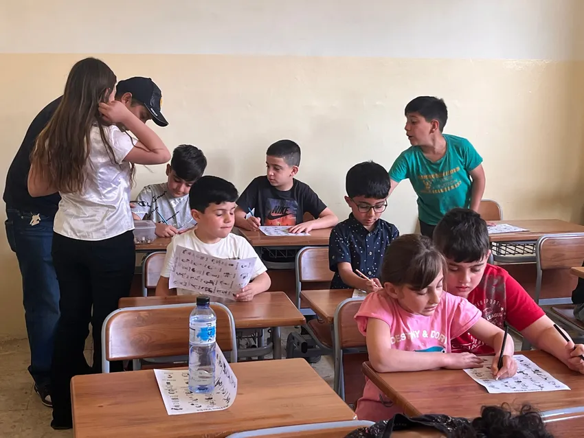 Some children have never entered a classroom before - it is lovely how they automatically help each other