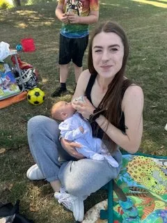 Baby being fed a bottle