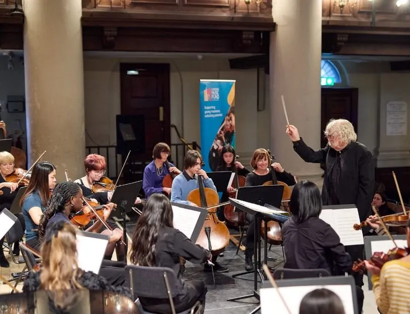 Sir Karl Jenkins CBE conducting LMF ensemble at 15th Anniversary Concert