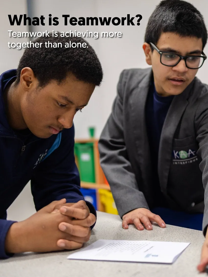 Two teenage boys working together to solve a problem