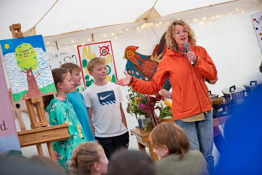 Pupils from Monmouthshire presenting their deforestation dishes at Abergavenny Food Festival hosted by Kate Humble