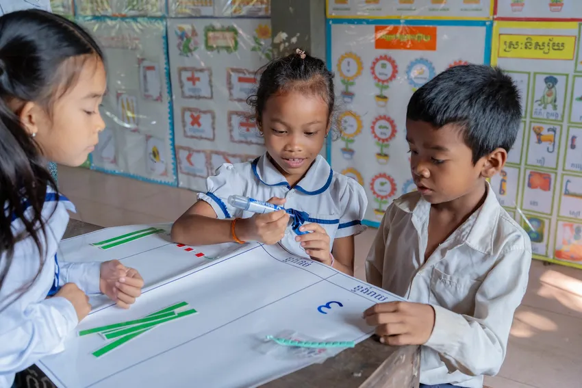 Children using bespoke teaching resources whilst enjoying their maths lesson