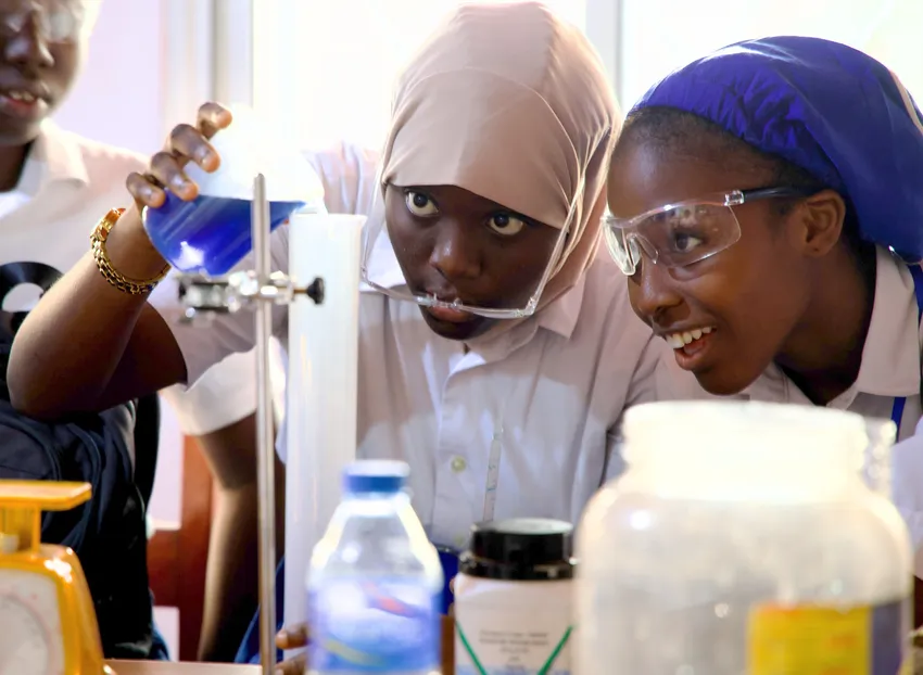 Two female students enjoying practical science class at CRS