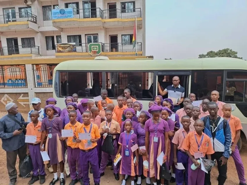 Grade 6 students travelling to the Sierra Leonean embassy to take their end of primary exams