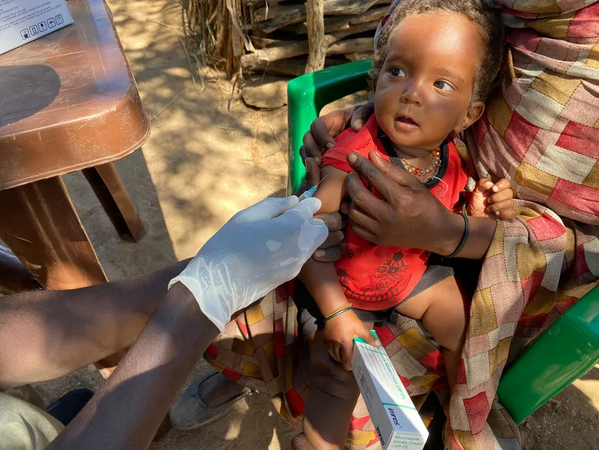 Aarifa* (16 months) receives a vaccination at a remote refugee camp in Central Darfur (*name changed)