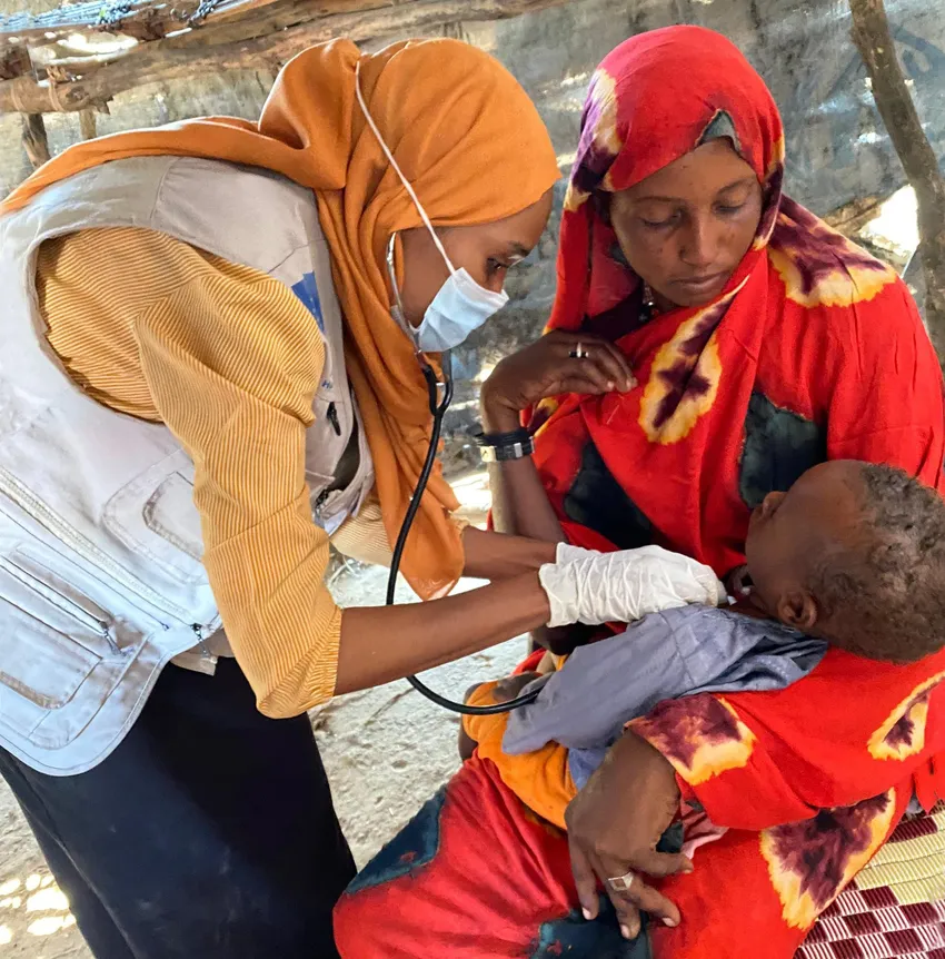 Abdul Wadood* (17 months) receives a check up with his mother Atifa* (28), in a remote refugee camp in central Darfur (*names changed)