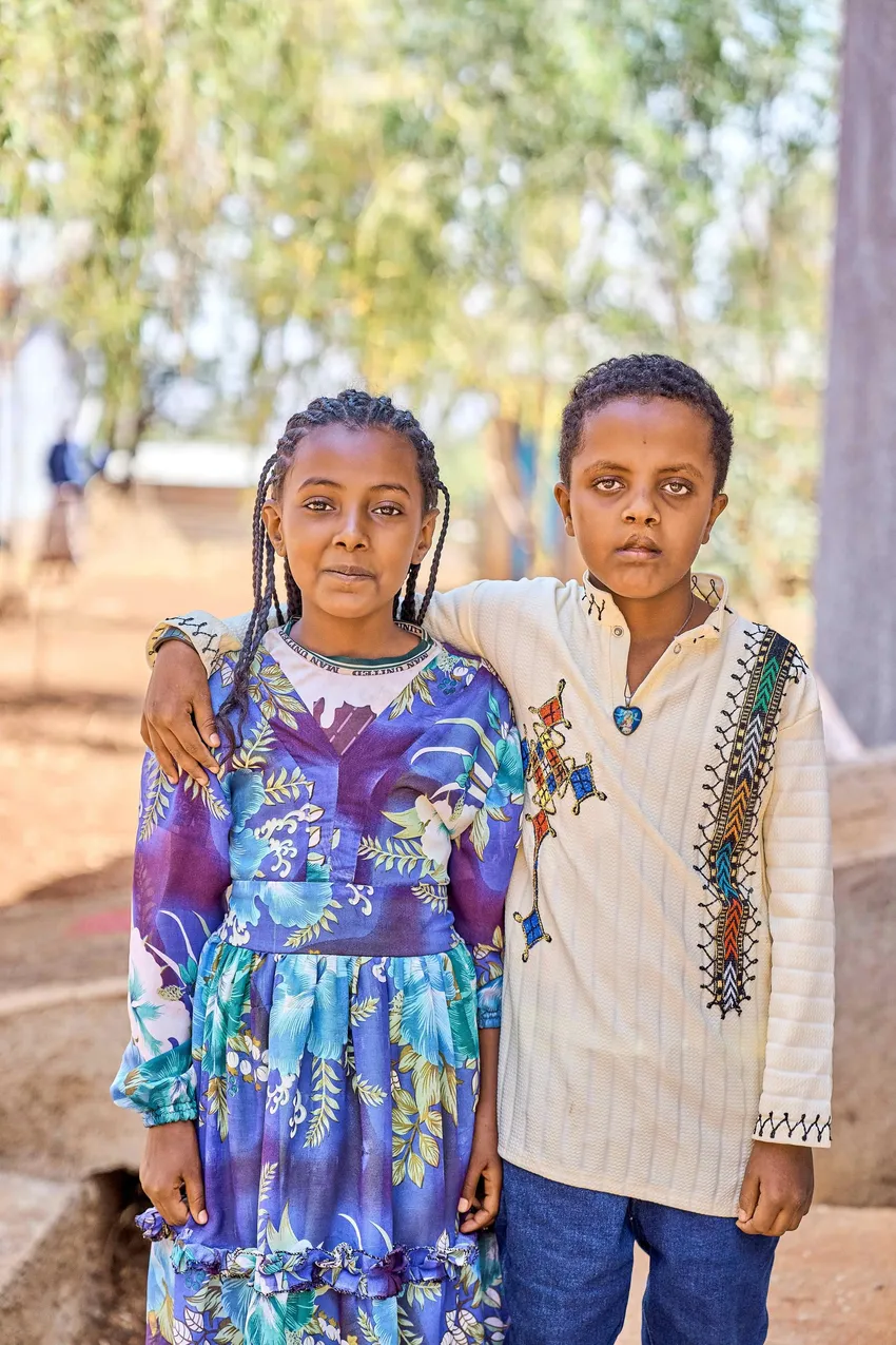 Temesgen with his sister, after cleft surgery.