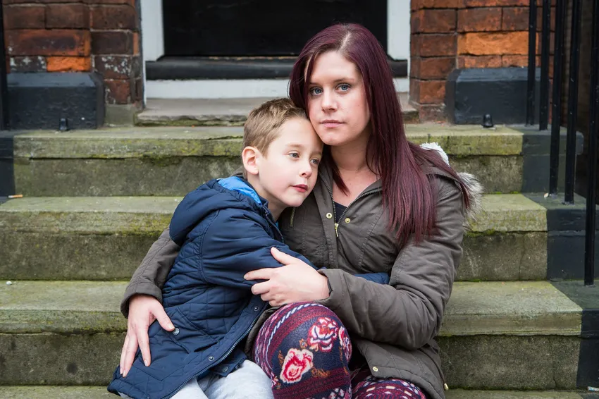 A survivor of domestic abuse with her son.