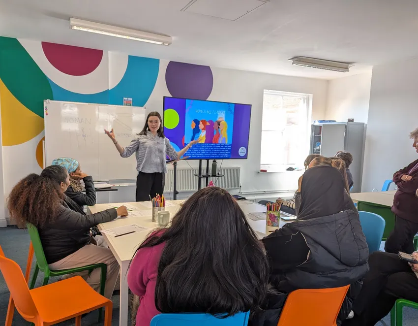 Refugee women being taught about UK culture.