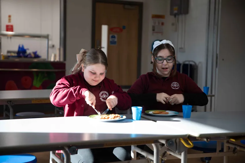Enjoying beans on toast