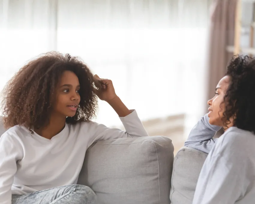 Young person speaking to older lady