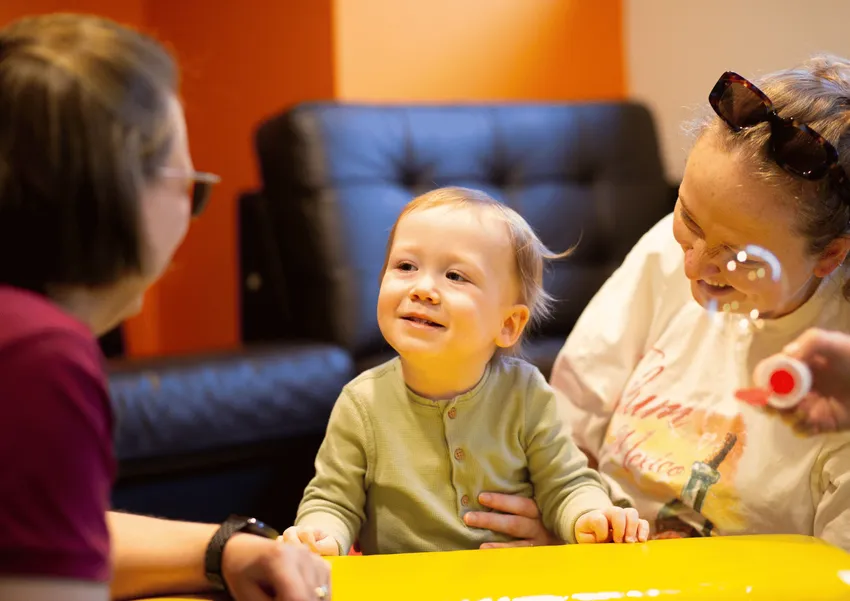 Child and his mother in a therapy session