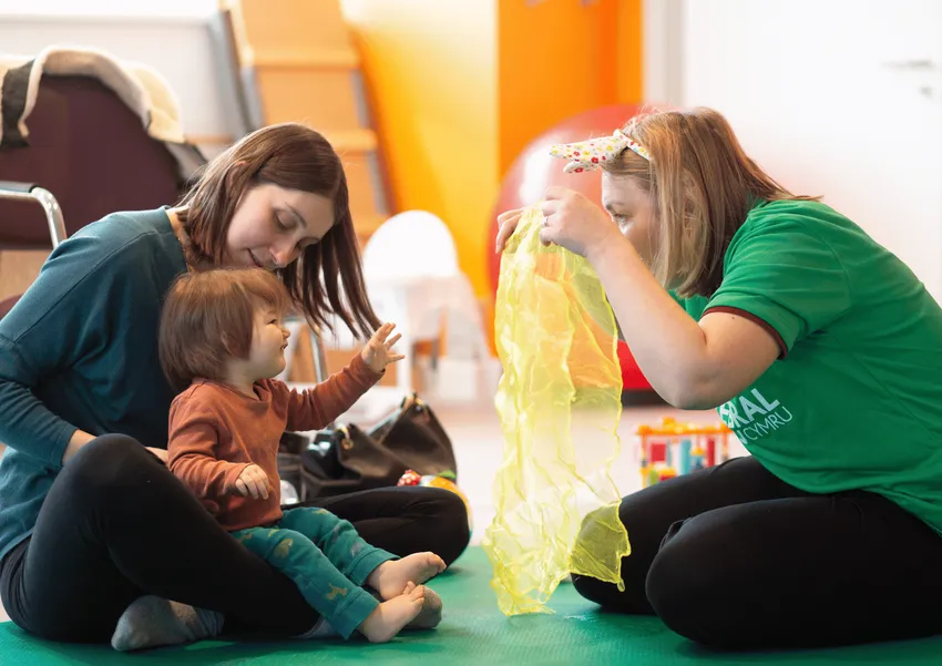 Baby and her mother with our Better Start Together Lead and Therapist.