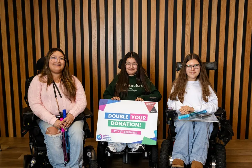 Three teenage girls in wheelchairs