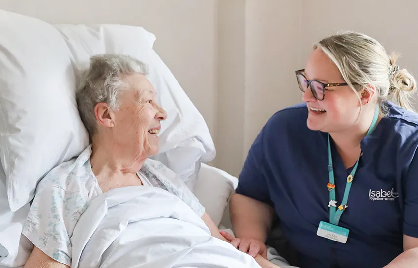 A patient speaks with an Isabel Hospice nurse.