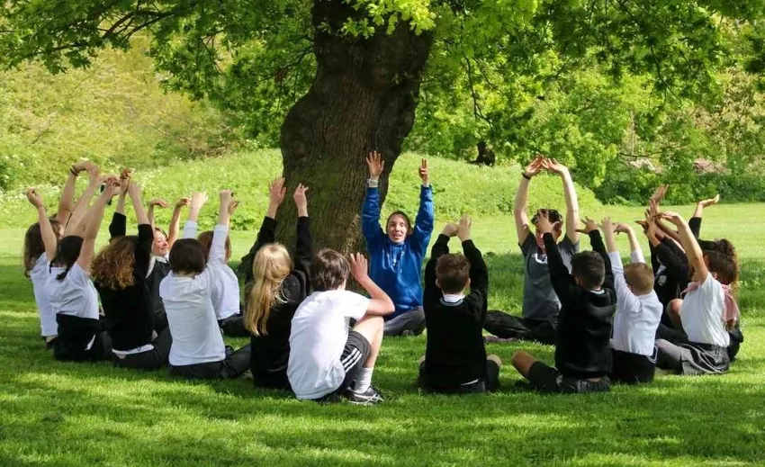Students take part a Tiny Forest Planting Day with Earthwatch Europe staff