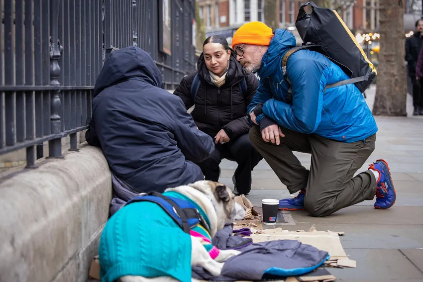 A pair of outreach workers support someone sleeping rough