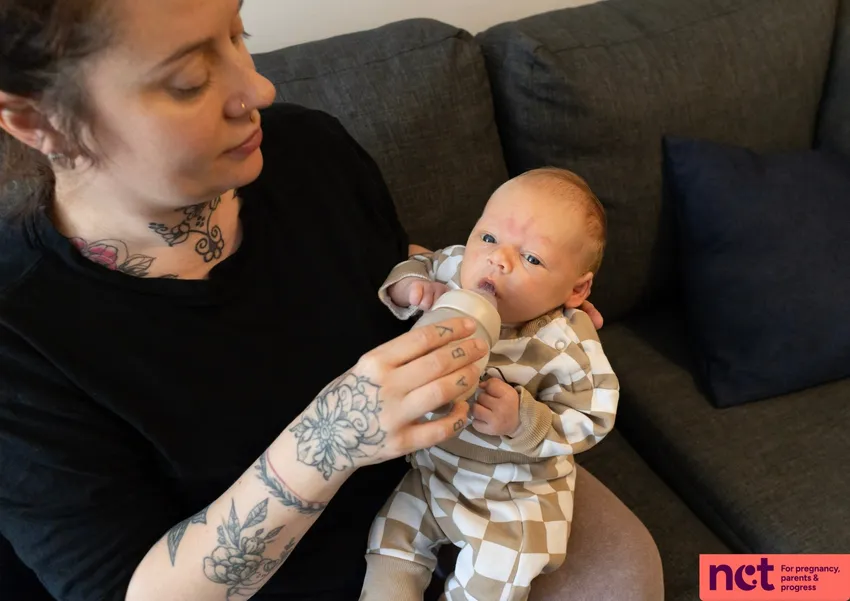 mother bottle feeding