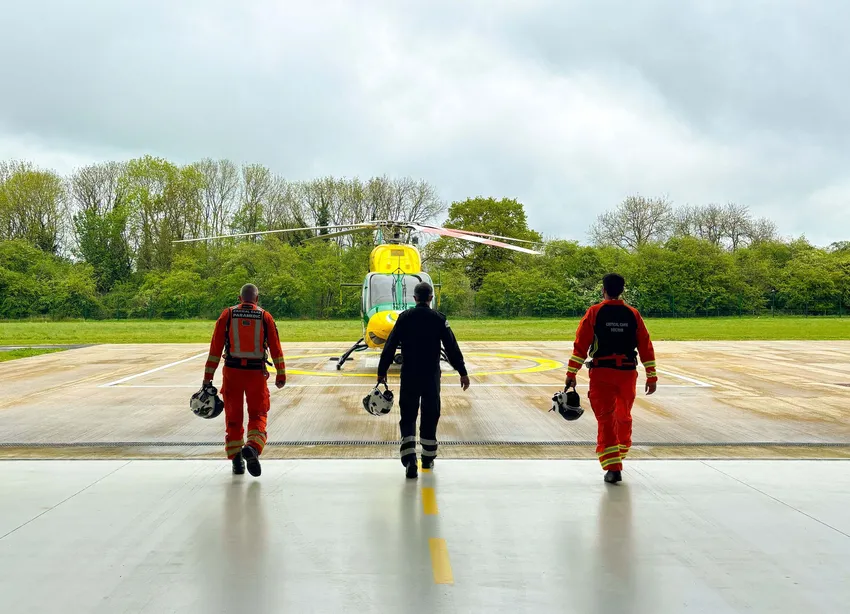 Crew walking to helicopter