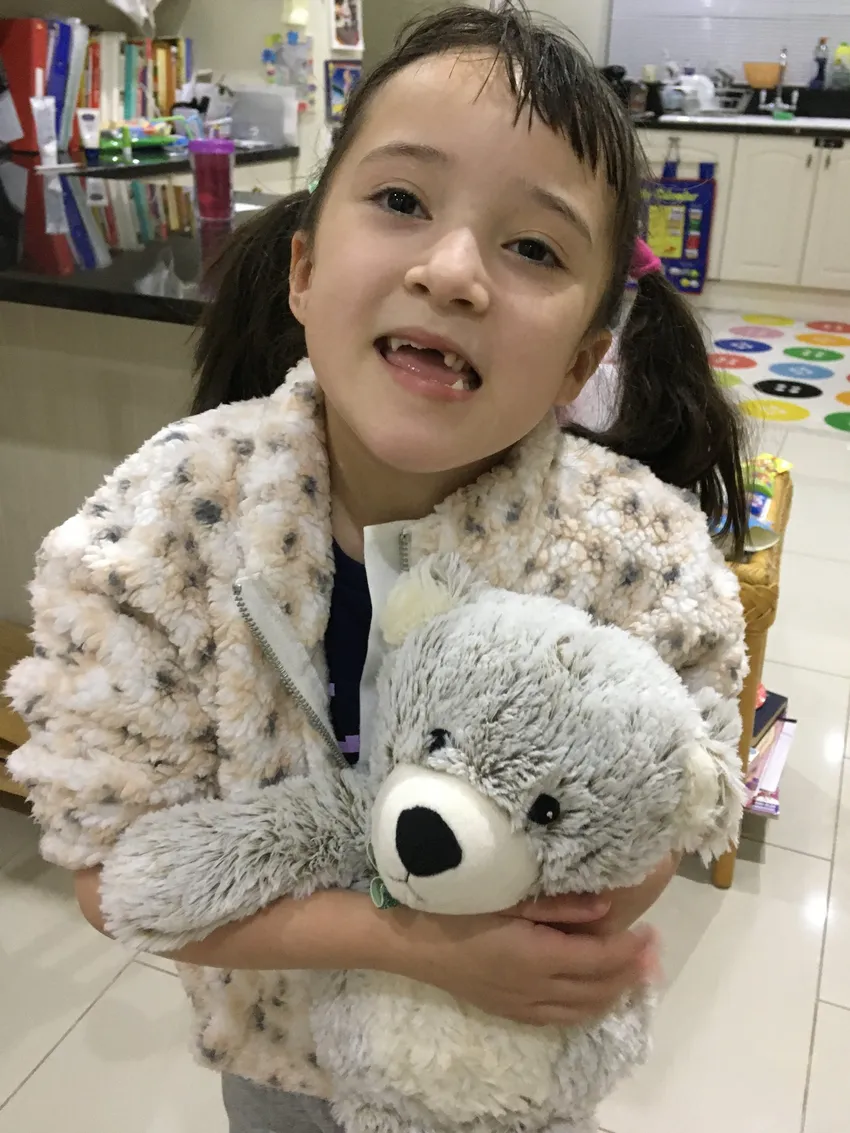 Sayuri with Cutie the Warmies bear from her Kids Kit