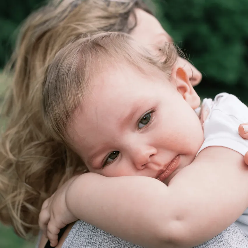 mum holding baby