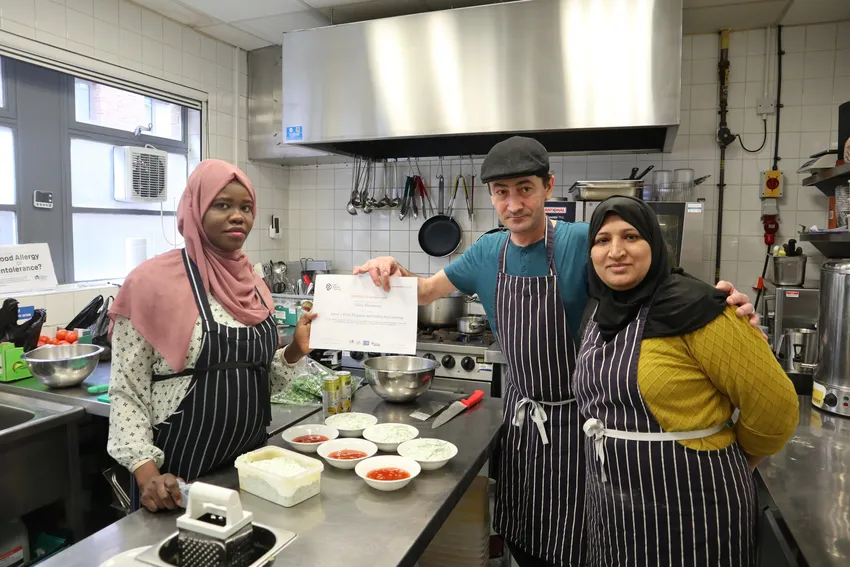 Catering Trainees holding up their certificate