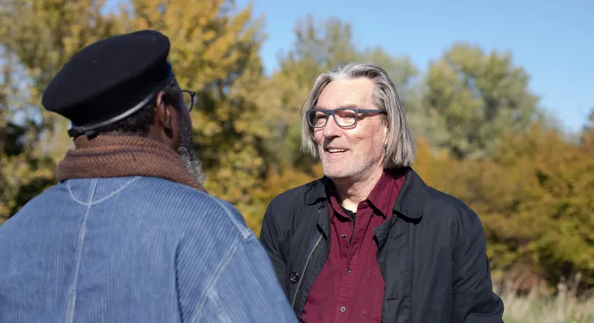 2 men talking