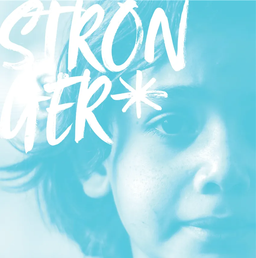 An image of a young girl looking at the viewer with the caption 'stronger' written in all caps. The image has a light blue overlay and the text is white.