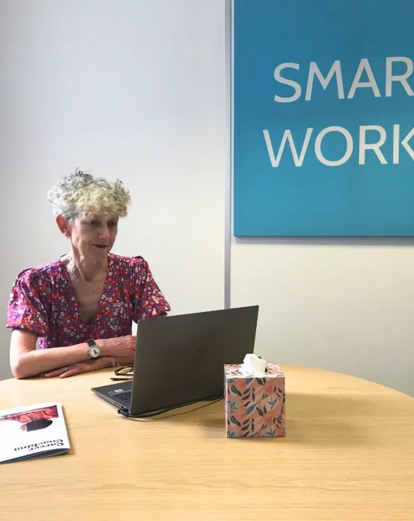 Smart Works Coach Alison sits at her desk preparing for a client coaching session at Smart Works Reading.