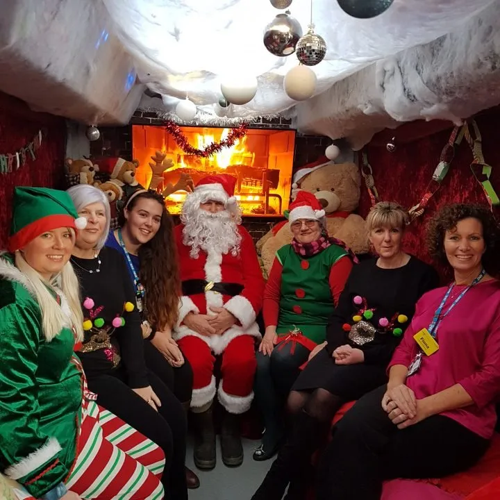 Santa invites staff at Warwick Hospital onto the Grotto
