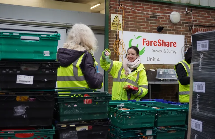 Two volunteers packing crates
