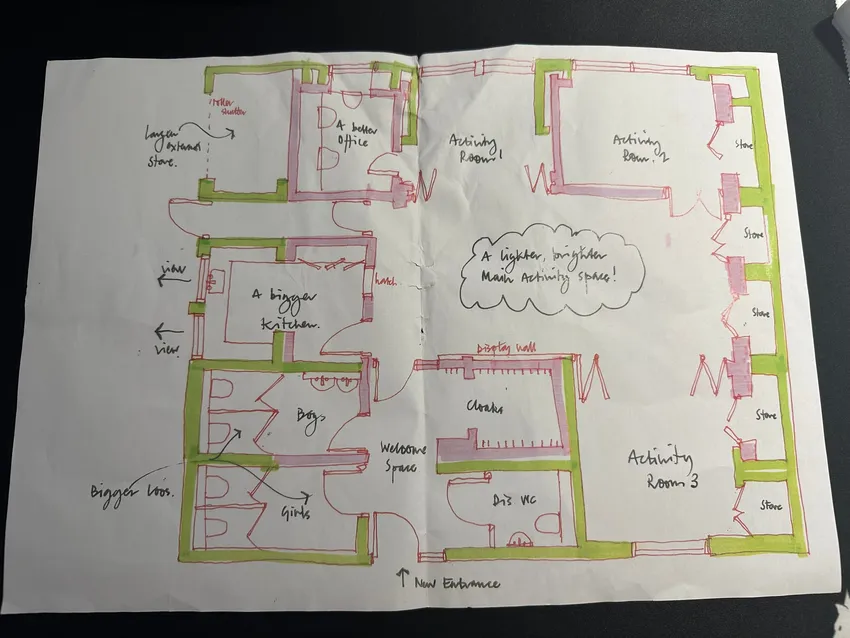 Early hand-drawn floor plans showing the community-led redesign of NW5 Hut, including a new entrance, larger kitchen, accessible toilets, and flexible activity spaces.