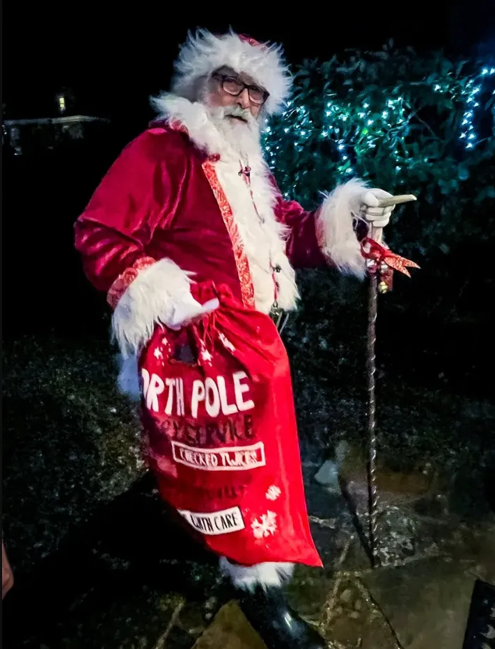 Doorstep Santa arriving to visit a special family