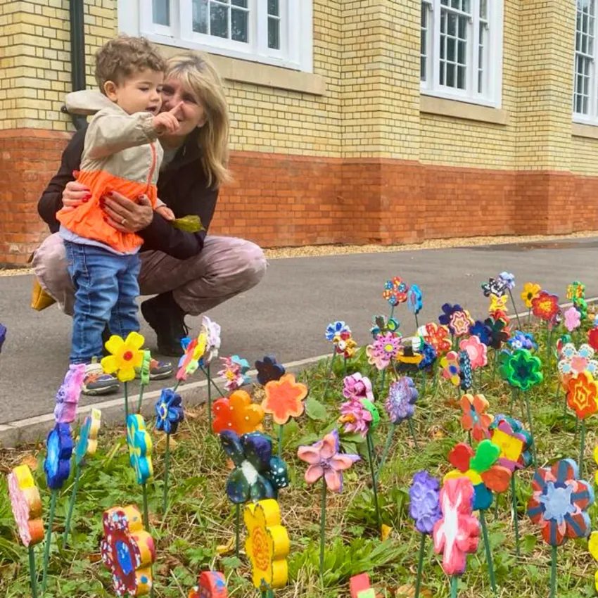 Families enjoying outdoor exhibitions in The Horton Gardens